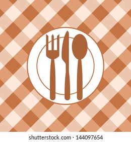 Plate and cutlery on the background of the tablecloth. Abstract image.