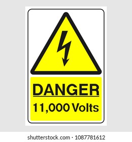 Plate: "Danger. 11,000 Volts". Sign: "Danger. 11,000 Volts" on a gray background
