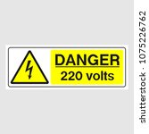 Plate: "Danger. 220 Volts". Sign: "Danger. 220 Volts" on a gray background
