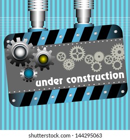Plate with gears and the text under construction written with white letters