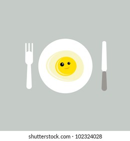 a plate of happy fried egg with fork and cutlery