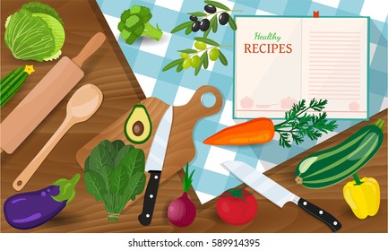 plate knife and fork on a red tablecloth in a cage. Cooking concept. Groceries on wooden table