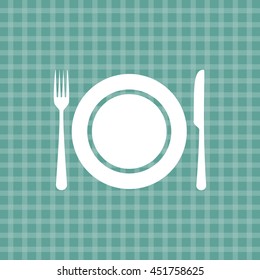 Plate knife and fork on turquoise picnic checkered tablecloth