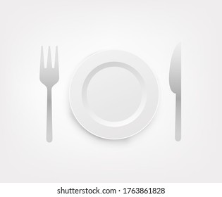 Plate, spoon and fork isolated on white background