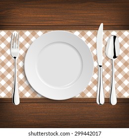 Plate with spoon, khife and fork on a wood table. Vector EPS10 illustration. 