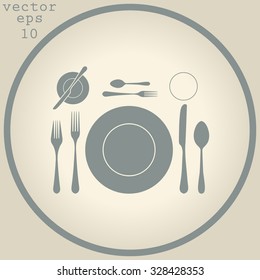 plate with spoon, knife and fork