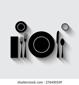 plate with spoon, knife and fork   on a grey background
