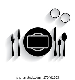 plate with spoon, knife and fork with shadow