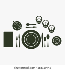 Plate with spoon, knife, napkin, cup, glass and fork. Cutlery etiquette rules symbol.