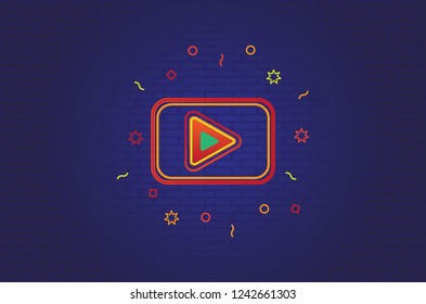 Play Button Bright Colors on Dark Wall Background