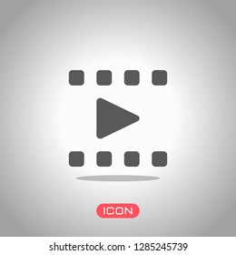 Play movie, watch film, photo strip, media icon. Icon under spotlight. Gray background