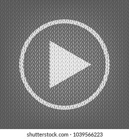 Play sign illustration. Vector. White knitted icon on gray knitted background. Isolated.