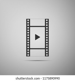Play Video icon isolated on grey background. Film strip with play sign. Flat design. Vector Illustration