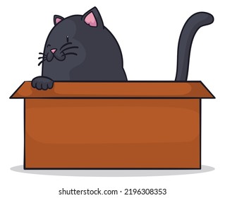 Playful black cat winking at you while it plays inside a cardboard box.