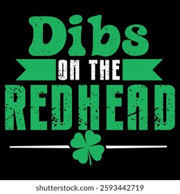 A playful and bold design featuring distressed green and white typography with a shamrock, declaring "Dibs on the Redhead" in a St. Patrick's Day-inspired theme.