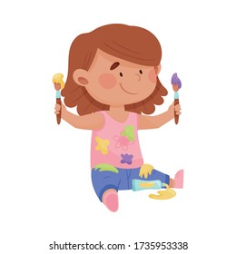 Playful Girl in Stained Clothes Sitting and Holding Paintbrushes and Paints Vector Illustration