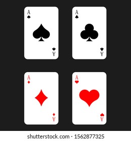 
Playing cards. Four different suits located separately from each other on a dark background. Poker. Winning combination

