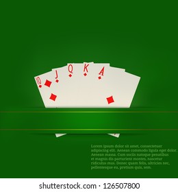 Playing cards on a green background