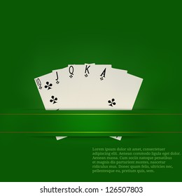 Playing cards on a green background