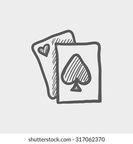 Playing cards sketch icon for web, mobile and infographics. Hand drawn vector dark grey icon isolated on light grey background.