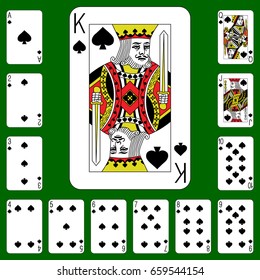 Playing cards of Spades on a green background. 