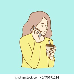 Pleasant young woman talking on cell phone
