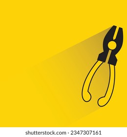 pliers with shadow on yellow background