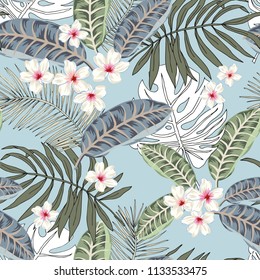 Plumeria flowers and graphic palm leaves, blue background. Vector floral seamless pattern. Tropical illustration. Exotic plants and fruits. Summer beach design. Paradise nature