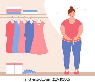 Plump woman stands at the wardrobe, measuring her waist with  tape measure. She's upset about being overweight. 