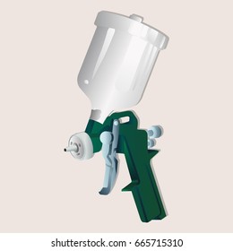Pneumatic tools the paint spray gun on wood and metal with a tank located on top