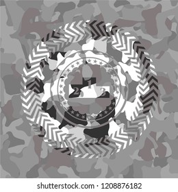 podium icon inside grey camo emblem