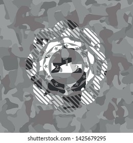 podium icon inside grey camo emblem