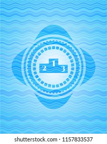 podium icon inside light blue water wave badge background.