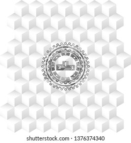 podium icon inside realistic grey emblem with geometric cube white background