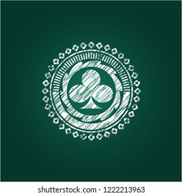 poker clover icon inside chalk emblem written on a blackboard