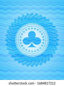 poker clover icon inside sky blue water wave emblem.