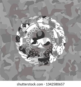 poker clover icon on grey camouflage pattern