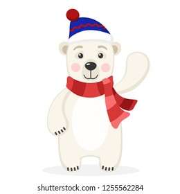 Polar bear in a scarf and hat waving his paw on a white.