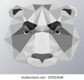 Polar bear. Symmetrical vector illustration of a polar bear. Made in low poly triangular style.