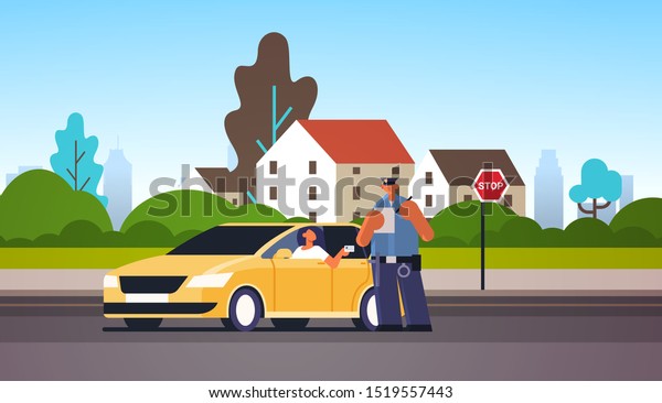 police officer writing report parking fine or\
speeding ticket for woman sitting in car showing driver license\
road traffic safety regulations concept cityscape background full\
length horizontal