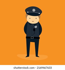 A policeman in uniform and a cap stands with his hands behind his back