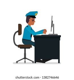 The policeman works at the computer. Isolated on a white background.