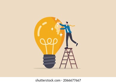 Polishing idea or finalize to be perfect and best quality result, attention to details, craftsmanship concept, smart businessman climb up ladder to clean and polish lightbulb for best quality idea.