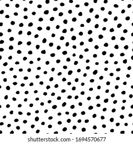 Polka dot background, Irregular hand drawn seamless pattern. Black and white vector illustration