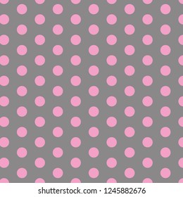 Polka dot pattern. Pink circles on grey background. 