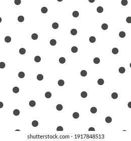 Polka dot seamless pattern. Black circles on a white background. Trendy geometric design.