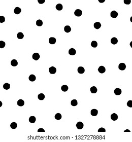 Polka dot seamless pattern in hand draw style. Vector spot texture with black point isolated on white background. Grunge effect.