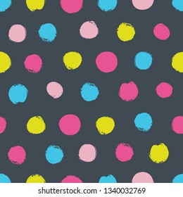 Polka dot seamless pattern on dark background.