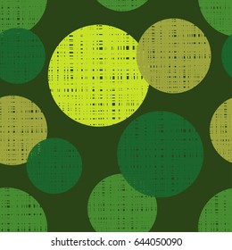 Polka dot seamless pattern on a green background. 
