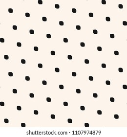 Polka dot seamless pattern. Simple minimalist black and white background. Vector monochrome subtle texture with small diagonal spots, dots, ovate shapes. Abstract minimal design for decoration, prints